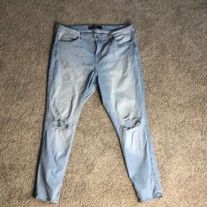 Hollister women’s curvy high-rise ripped light wash skinny jeans.